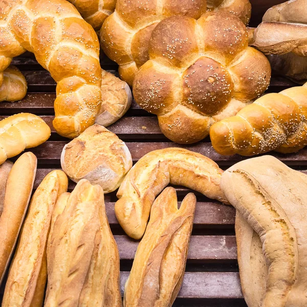 Fresh baked breads in baker shop in Sicily — Stock Photo, Image