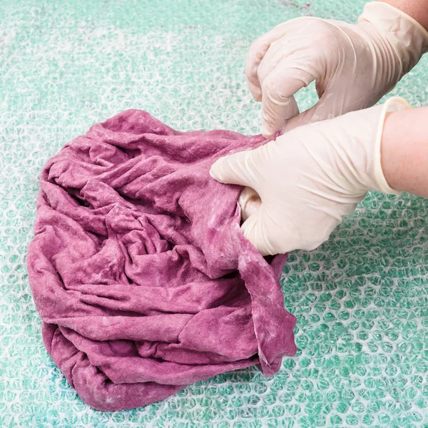 Hatter mats the wet felt hood from wool fibers — Stock Photo, Image