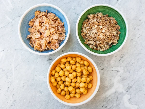 Three kind of cold breakfast cereals on table — Stock Photo, Image