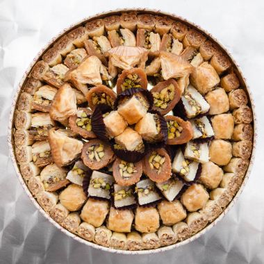 many arabian sweet pastry baklava on plate clipart