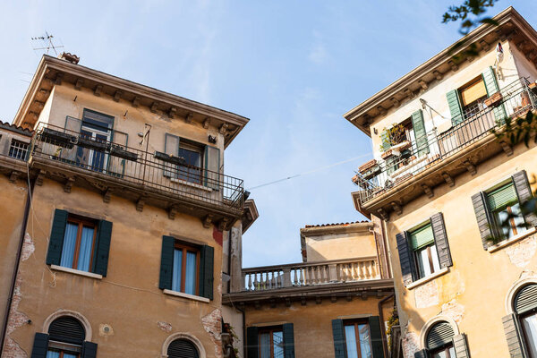 Travel to Italy - urban houses on street Calle di Mezzo in Venice city in spring