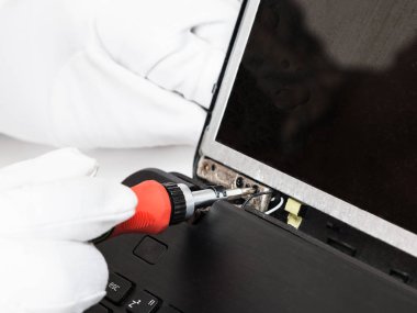 serviceman in white gloves fixes LCD screen clipart