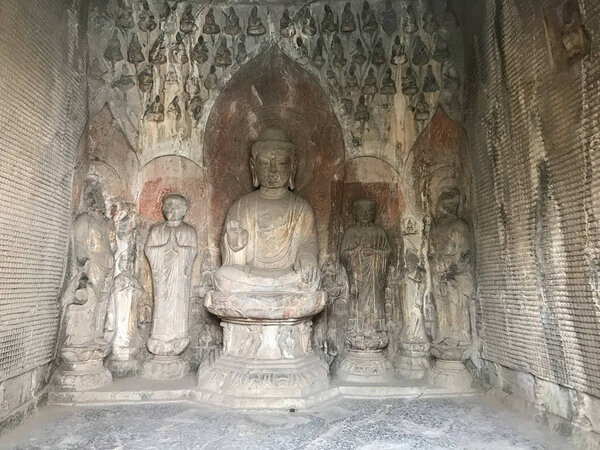 carved figures with Sakyamuni statue in Grotto