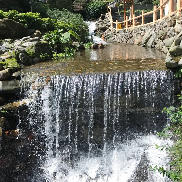 waterfall with warm water from hot spring