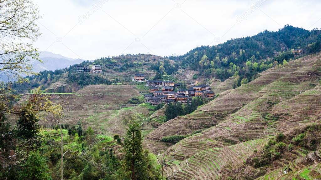 view of Dazhai village on green hills