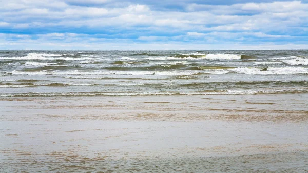 Rainy clouds over beach of Baltic Sea in autumn — Stock Photo, Image