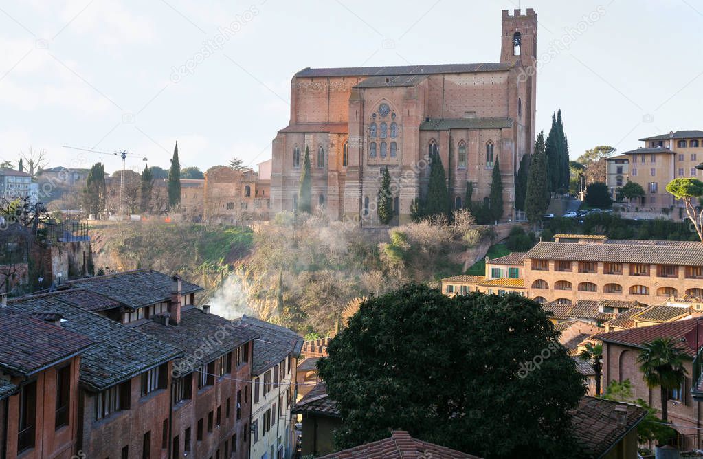 Basilica in Siena city on hill in winter