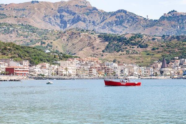 Boats in sea near waterfront of Giardini Naxos — Stock Photo, Image