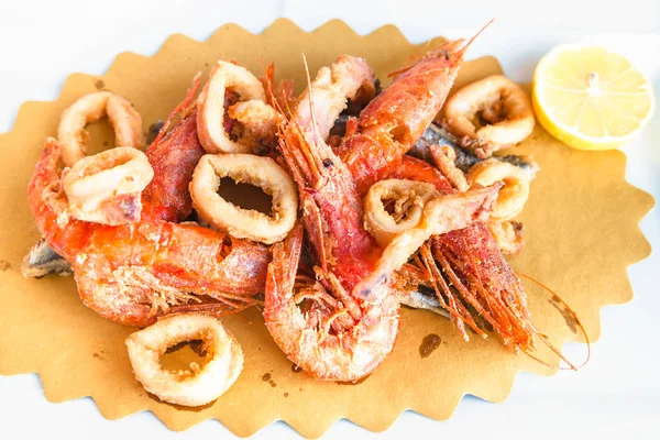 Above view of plate with fried local seafood — Stock Photo, Image