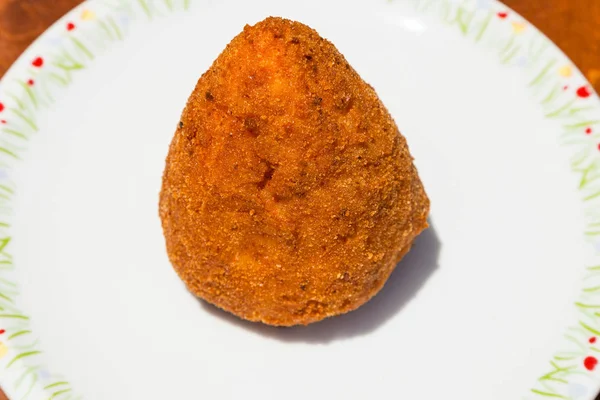 One meat stuffed rice ball arancini on table — Stock Photo, Image