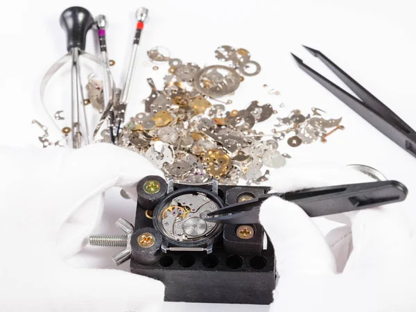 Repair of mechanic wristwatch with spare parts — Stock Photo, Image