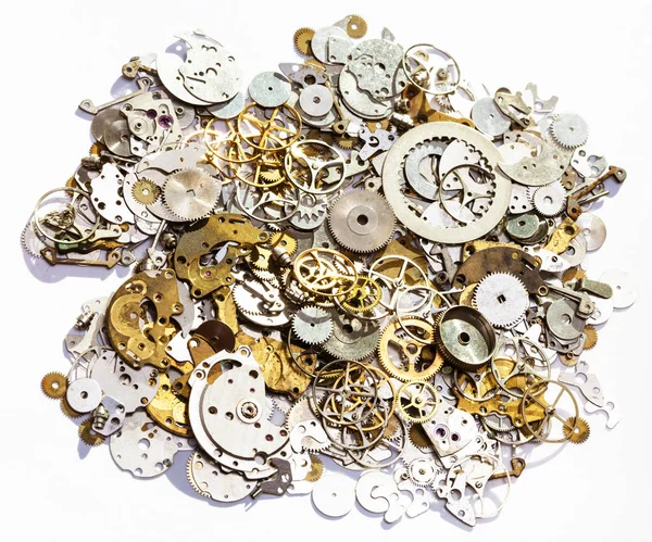 Mucchio di vecchi pezzi di ricambio orologio su sfondo bianco — Foto Stock