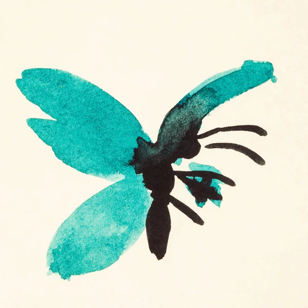 Метелик з зеленими крилами на кремовому папері — стокове фото