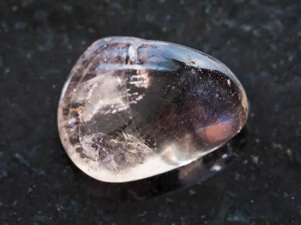 Tumbled smoky quartz gemstone on dark — Stock Photo, Image