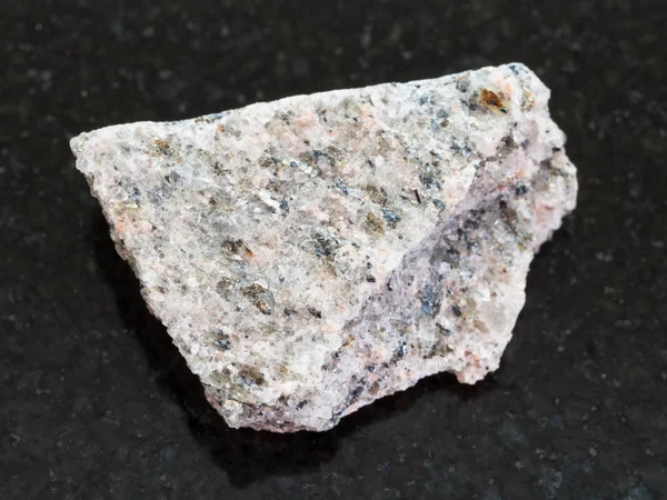 Raw Schist stone on dark granite background — Stock Photo, Image
