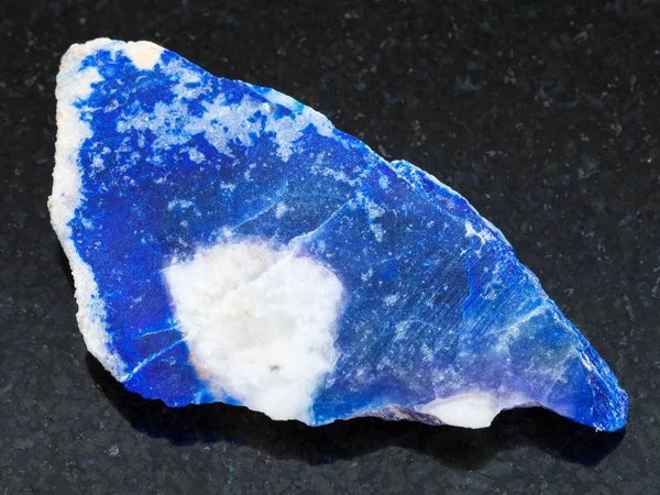 Rough lazurite (lapis lazuli) stone on dark — Stock Photo, Image