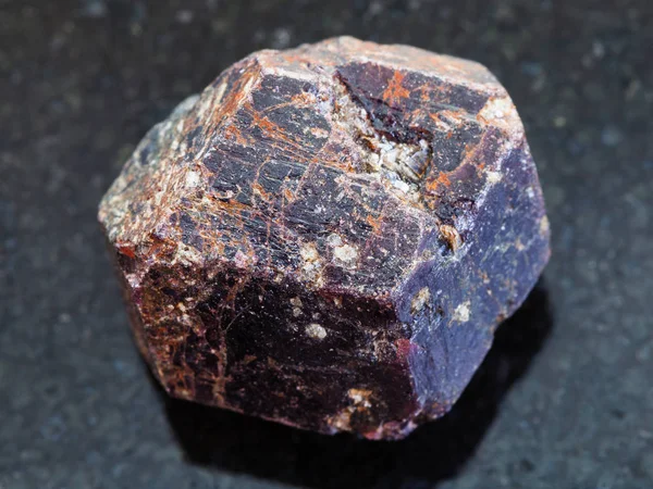 Raw crystal of dravite tourmaline gemstone on dark — Stock Photo, Image