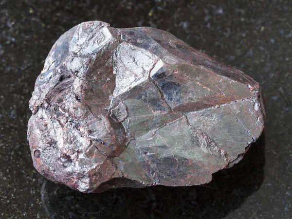 Raw hematite stone on dark background — Stock Photo, Image