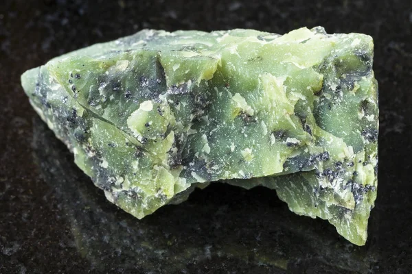 Rough Lizardite stone on dark background — Stock Photo, Image