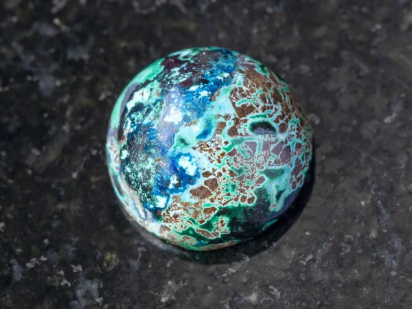 Cabochon from Chrysocolla gemstone on dark — Stock Photo, Image