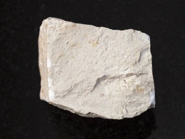rough chemical limestone stone on dark clipart