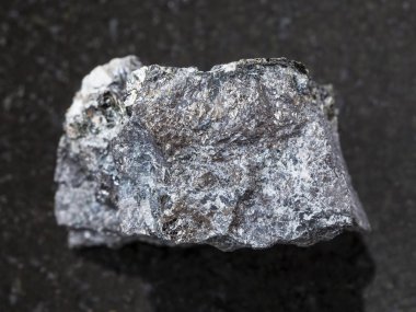 Magnetite ore on dark background clipart
