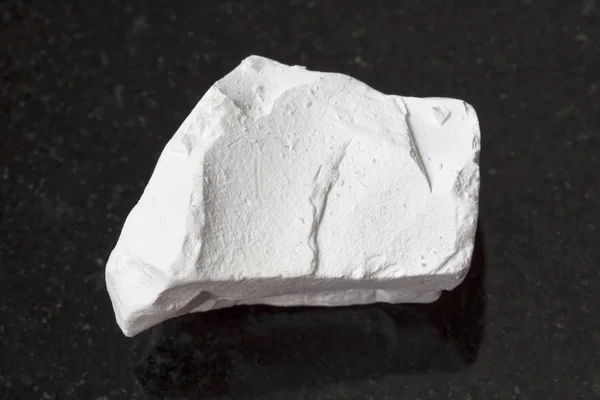 unpolished chalk (white limestone) rock isolated Stock Photo by vvoennyy