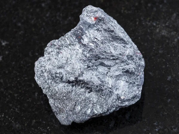 Raw antimony ore (Stibnite) stone on dark — Stock Photo, Image