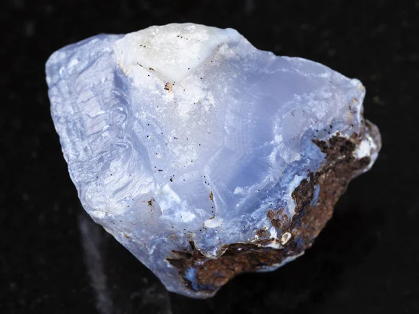 Rough crystal of blue Chalcedony gemstone on dark — Stock Photo, Image