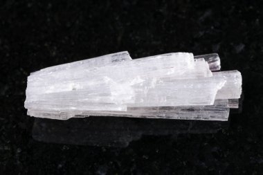 raw crystal of Scolecite gemstone on dark clipart