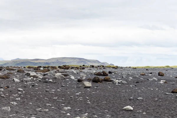 Surface of Reynisfjara black sand lava beach — Stock Photo, Image