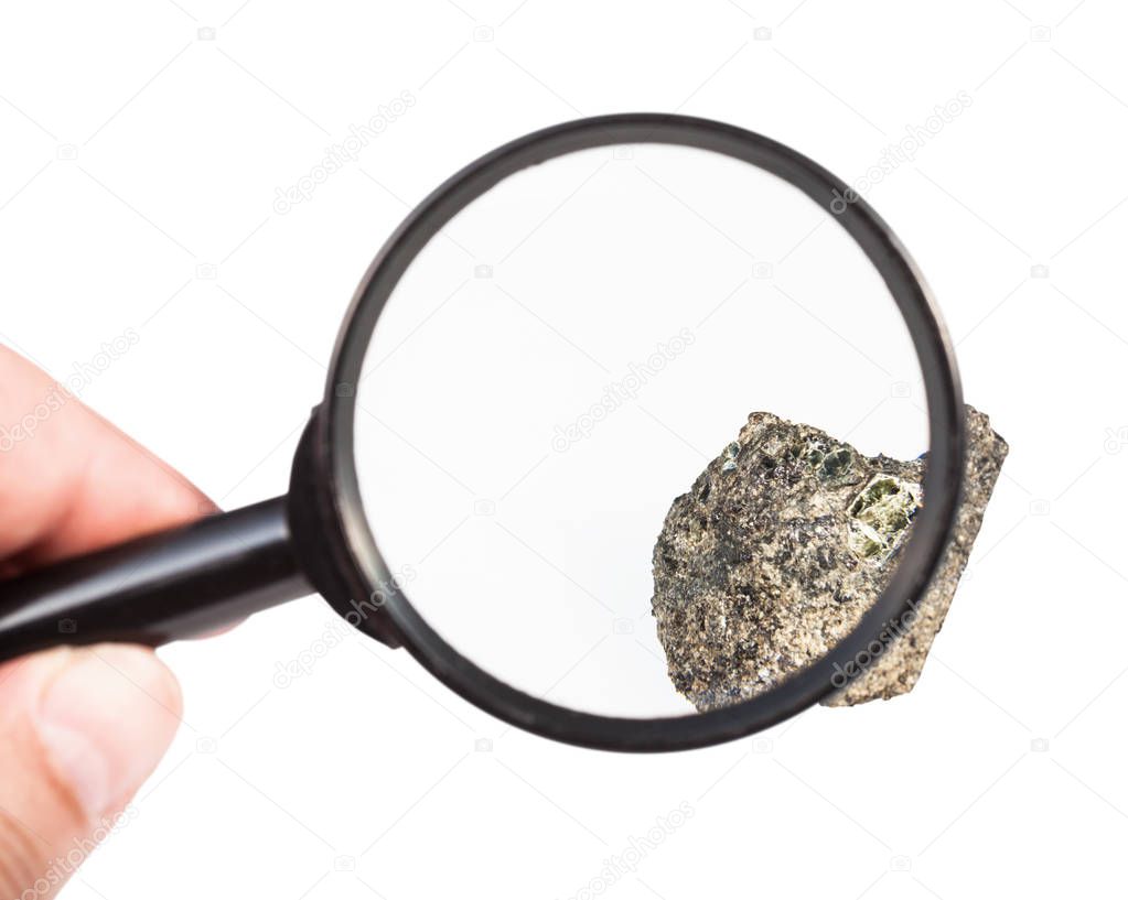 view of raw peridotite mineral through magnifier