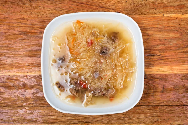 Cabbage soup with stewed sauerkraut in white plate — Stock Photo, Image