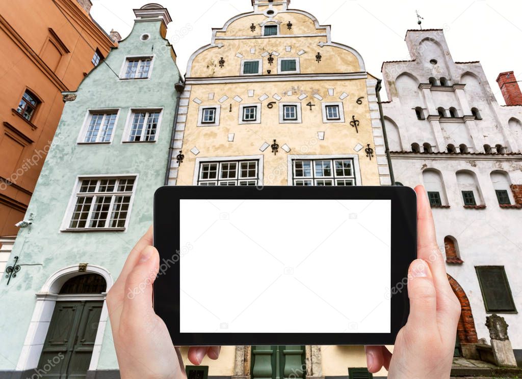 tourist photographs Three Brothers houses in Riga