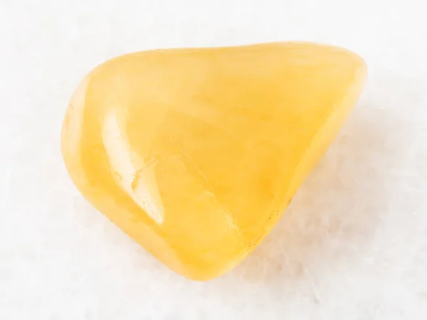 Polished yellow Aventurine gem stone on white — Stock Photo, Image