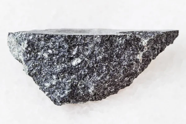 Pedaço de pedra dolerite (diabase) sobre branco — Fotografia de Stock
