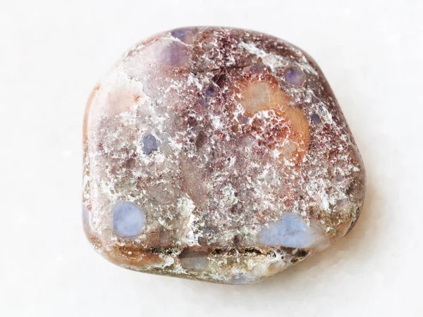 Polished porphyry gemstone on white — Stock Photo, Image