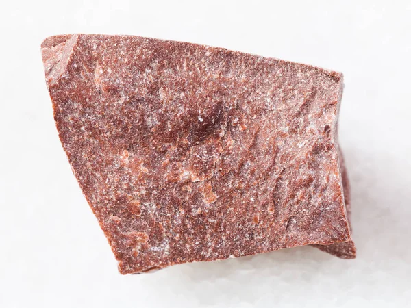 Piece of raw red marble stone on white — Stock Photo, Image