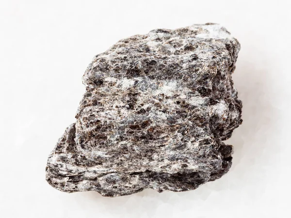 Piece of quartz-biotite schist stone on white — Stock Photo, Image