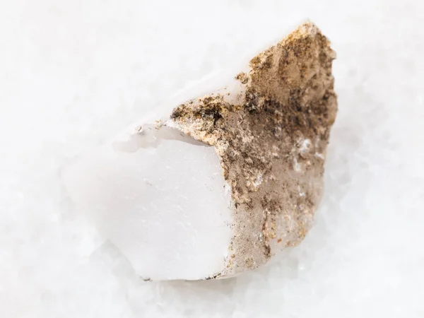 raw cacholong (white opal) stone on white