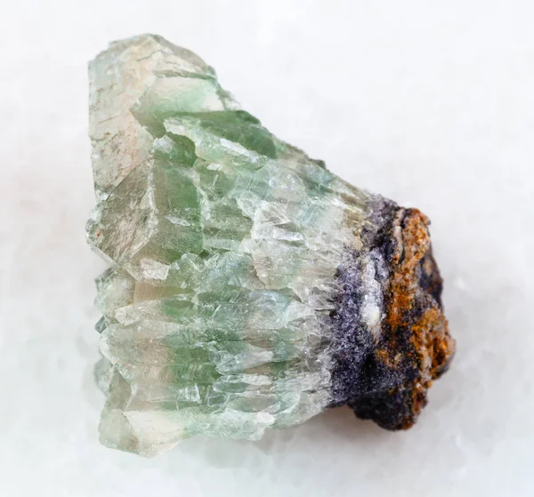 Rough crystalline fluorite gemstone on white — Stock Photo, Image