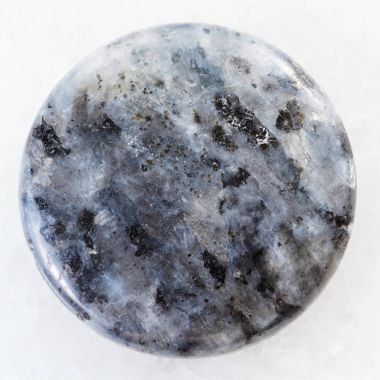 cabochon from gray Labradorite gemstone on white clipart