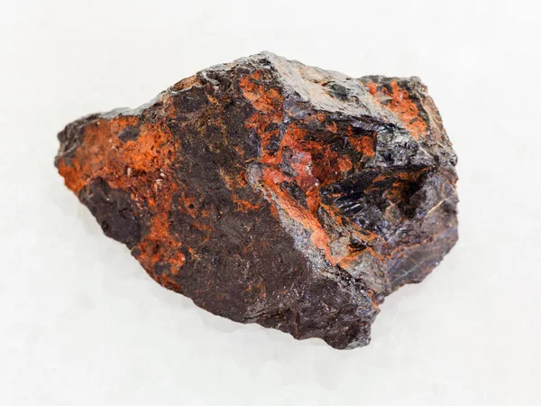 Raw Wolframite stone (tungsten ore) on white — Stock Photo, Image