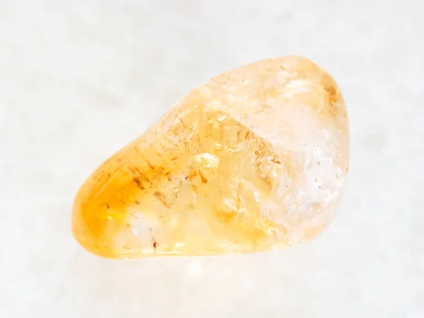 Polished Citrine gemstone on white marble — Stock Photo, Image