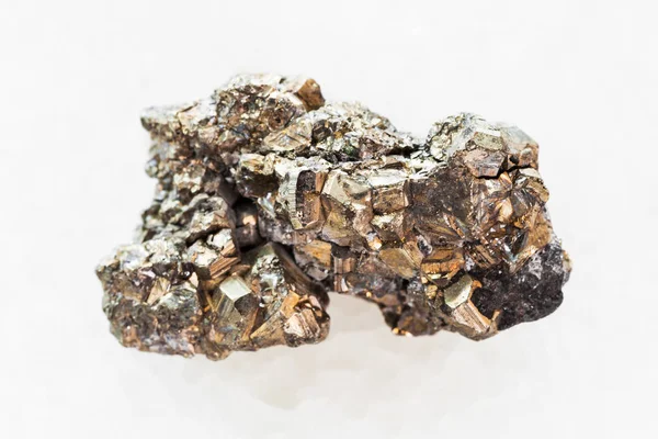 Pyrite stone on white marble — Stock Photo, Image