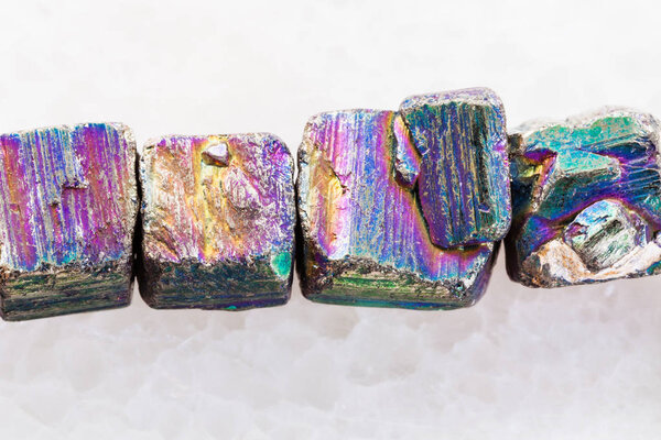 necklace from iridescent pyrite gemstone on white