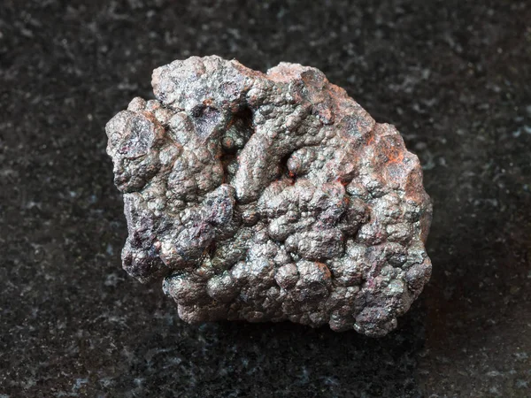Goethite stone (brown iron) on black — Stock Photo, Image