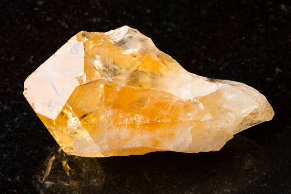 Crystal of Citrine gemstone on black — стоковое фото