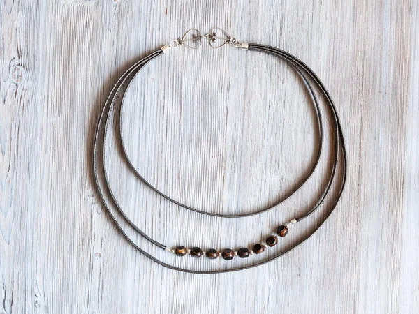 Necklace from leather strips and bone beads — Stock Photo, Image