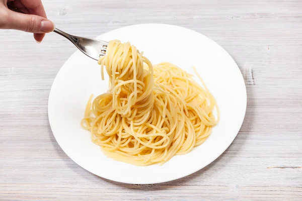 Top view fork wrapped of spaghetti al burro — Stock Photo, Image